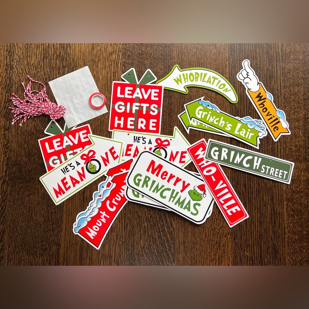 The Grinch signs with sticker dots and ribbon.